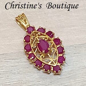 14K gold pendant with genuine ruby gemestones